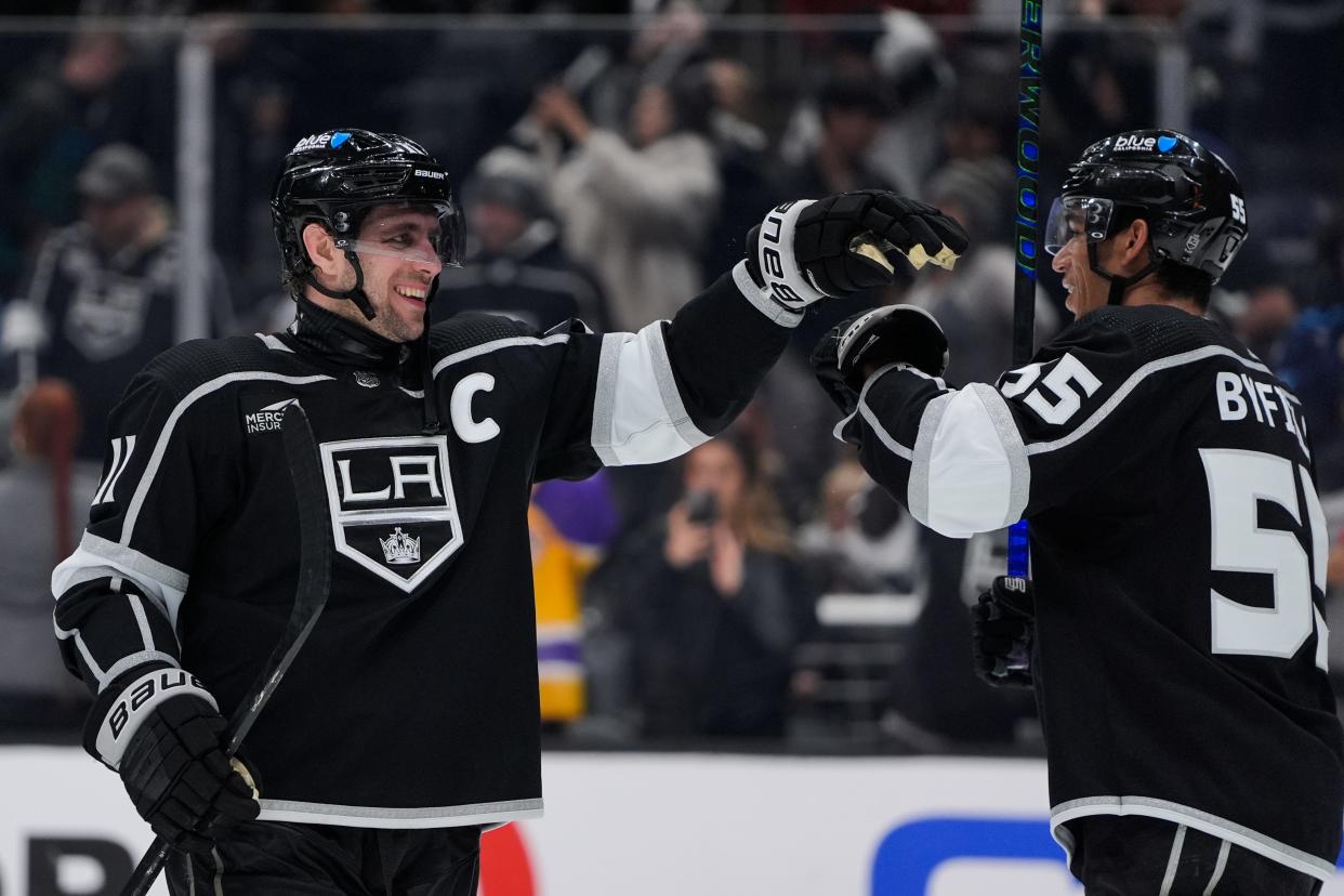 Los Angeles Kings center Anze Kopitar, left, celebrates with right wing Quinton Byfield after the team's win over the Columbus Blue Jackets in an NHL hockey game Tuesday, Feb. 20, 2024, in Los Angeles. (AP Photo/Ryan Sun)