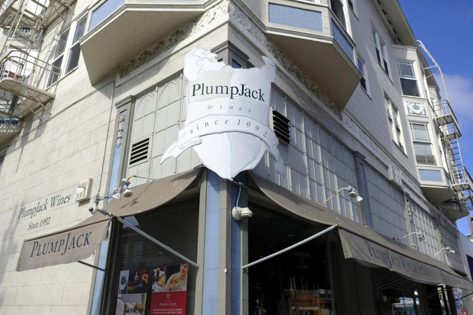 FILE - This Monday, Oct. 22, 2018, file photo shows the Plumpjack Wine & Spirits store in San Francisco, part of the Plumpjack Group collection of wineries, bars, restaurants, hotels and liquors stores. Governors, like California Gov. Gavin Newsom, who implemented shutdowns as their states responded to the coronavirus pandemic were among millions of beneficiaries of the loan program created to help small businesses, data released Monday, July 6, 2020 show. PlumpJack Management Group, LLC, Newsom’s winery and hospitality company he founded, received a loan worth $150,000 to $350,000. (AP Photo/Eric Risberg, File)