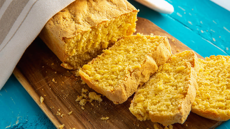 Sliced cornbread on cutting board