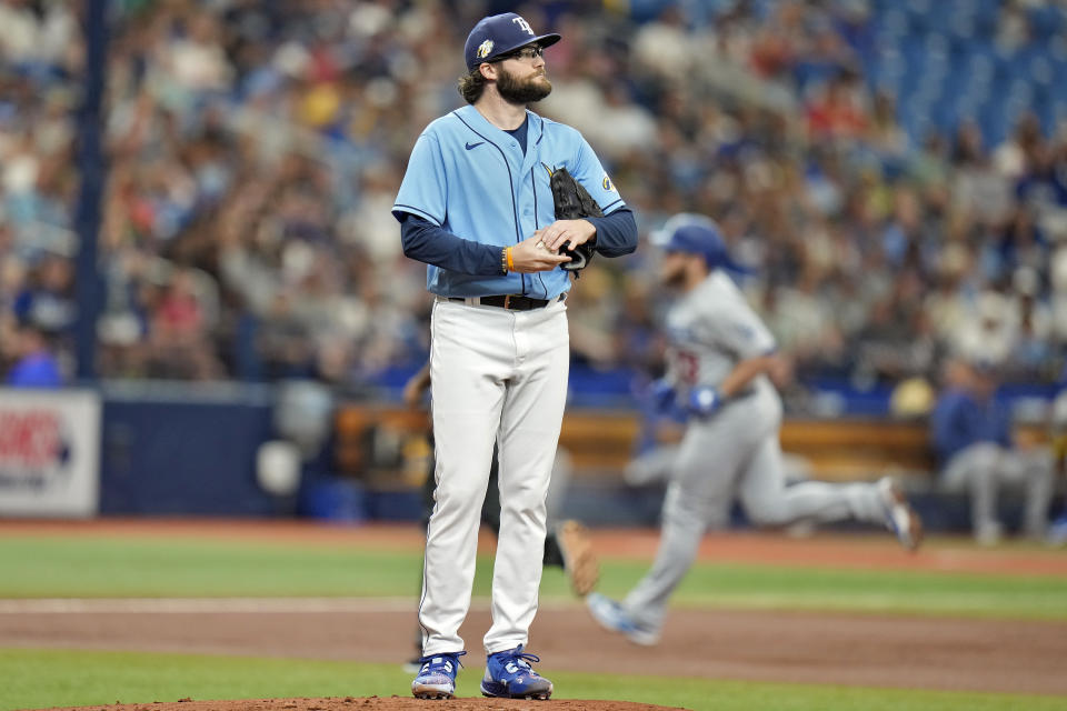 Tampa Bay Rays pitcher Josh Fleming reacts as Los Angeles Dodgers' Max Muncy runs around the bases after hitting a solo home run during the second inning of a baseball game Sunday, May 28, 2023, in St. Petersburg, Fla. (AP Photo/Chris O'Meara)