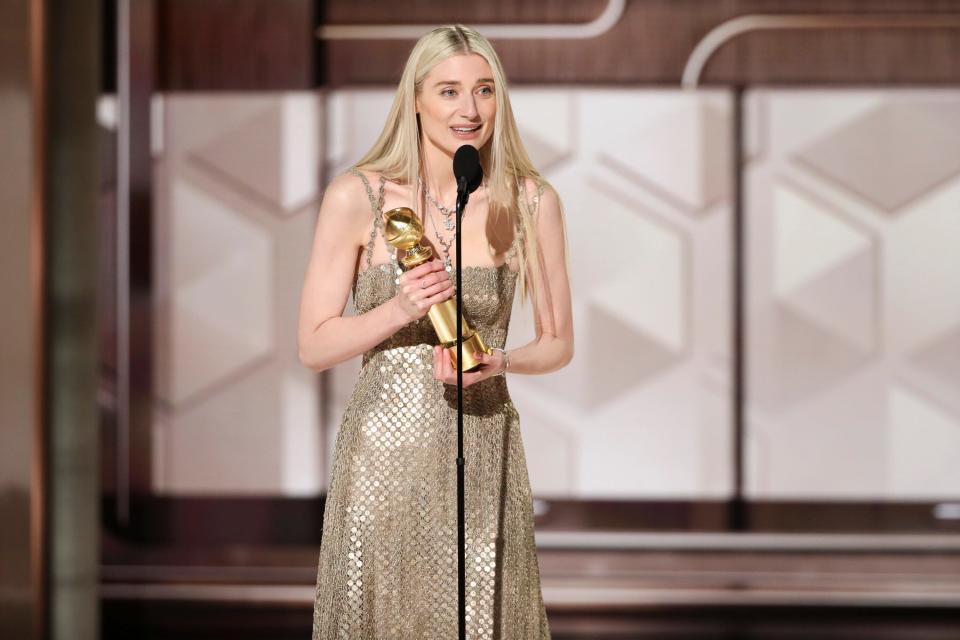 Elizabeth Debicki accepts the award for best performance by a female actor in a supporting role on television for her role as Princess Diana on the Netflix drama, "The Crown."