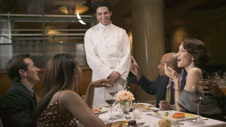 Chef interacting with guests 