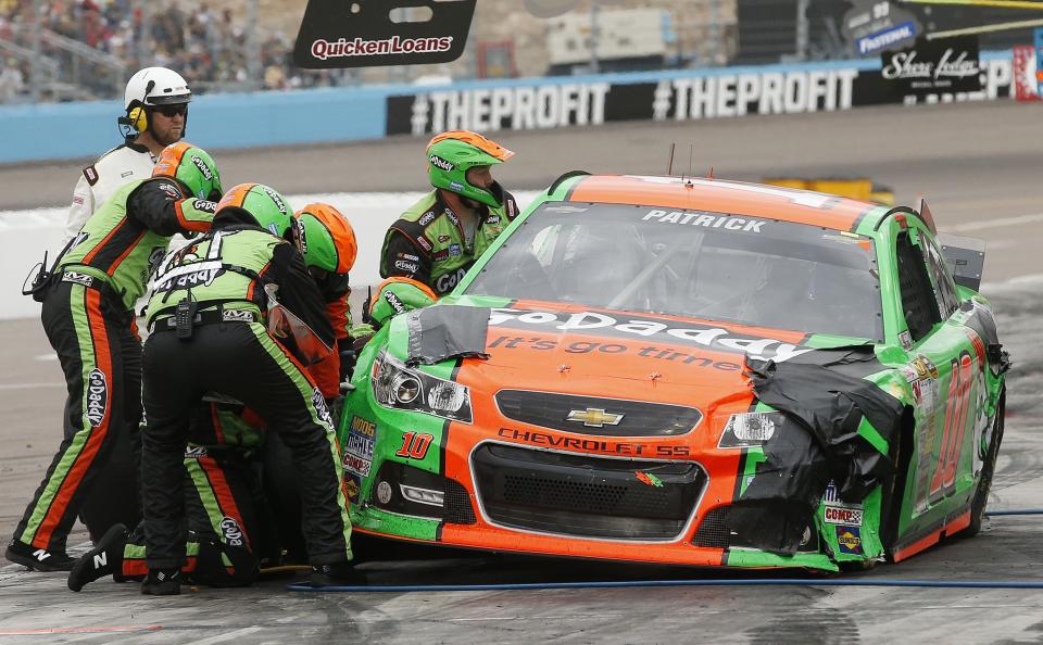 Danica Patrick makes a pit stop during the NASCAR Sprint Cup Series auto race Sunday, March 2, 2014, in Avondale, Ariz. (AP Photo/Ross D. Franklin)