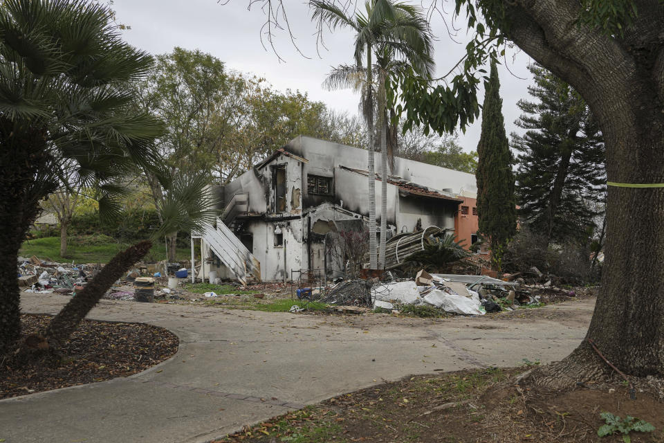 A battle-scarred home in Kibbutz Be'eri, an Israeli communal farm on the Gaza border, is seen Thursday, Jan. 11, 2024. Hamas held more than a dozen hostages in the home when it overran southern Israel on Oct. 7. At the end of an hours-long battle between the militants and Israeli forces, only two hostages survived, and relatives of the slain hostages now demand to know if their loved ones were killed by friendly fire from an Israeli tank. (AP Photo/Tsafrir Abayov)