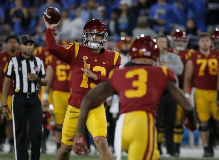 PASADENA, CALIF., NOV 19, 2022. USC quarterback Caleb. Williams passes to wide receiver Jordan Addison in the first half of the annual crosstown rivalry game, played at the Rose Bowl in Pasadena on Saturday night, Nov. 19, 2022. (Luis Sinco / Los Angeles Times)