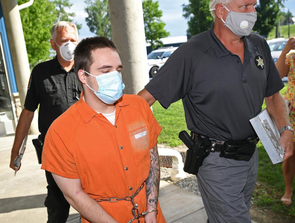 Cody Potthoff is led into a preliminary hearing at the North East Township municipal building on July 29, 2020. Potthoff, 26, pleaded guilty on Monday to fatally shooting two people in a June 2020 crime spree.