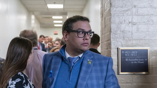 Rep. George Santos, R-N.Y., departs after a Republican caucus meeting.