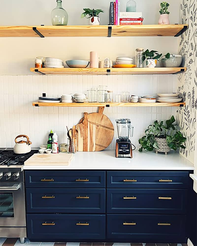 Open wooden shelves in newly renovated kitchen.