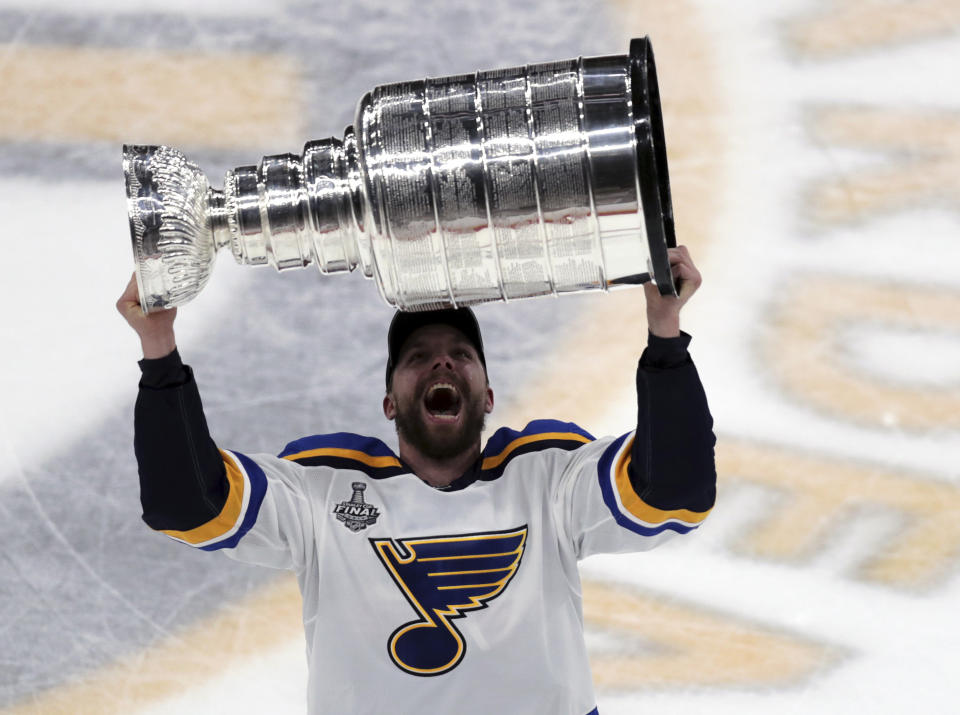 St. Louis Blues' David Perron carries the Stanley Cup after the Blues defeated the Boston Bruins in Game 7 of the NHL Stanley Cup Final, Wednesday, June 12, 2019, in Boston. (AP Photo/Charles Krupa)