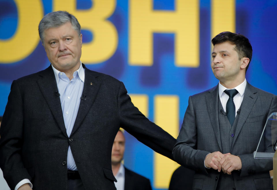 Ukrainian presidential candidate and popular comedian Volodymyr Zelenskiy, left, and Ukrainian President Petro Poroshenko participate in their final electoral campaign debate at the Olympic stadium in Kiev, Ukraine, Friday, April 19, 2019. Friday is the last official day of election canvassing in Ukraine as all presidential candidates and their campaigns will be barred from campaigning on Saturday, the day before the vote. (AP Photo/Vadim Ghirda)