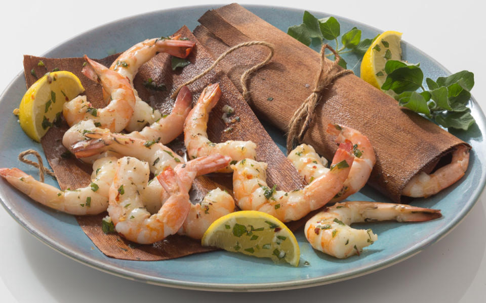 <p>Mark Boughton</p><p>Wrapping shrimp in "grilling papers" add a delicious, smoky flavor.</p><p><strong>Get the recipe: <a href="https://parade.com/659392/alison-ashton/cedar-wrapped-grilled-shrimp/" rel="nofollow noopener" target="_blank" data-ylk="slk:Cedar-Wrapped Grilled Shrimp;elm:context_link;itc:0;sec:content-canvas" class="link ">Cedar-Wrapped Grilled Shrimp</a></strong></p>