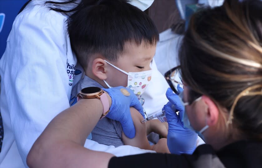 LOS ANGELES CA JUNE 21, 2022 - Aevin Lee, 2, son of Dr. Jennifer Su, cardiologist, receives the Pfizer COVID vaccine on Tuesday, June 21, 2022 at Children's Hospital Los Angeles. (Wesley Lapointe / Los Angeles Times)