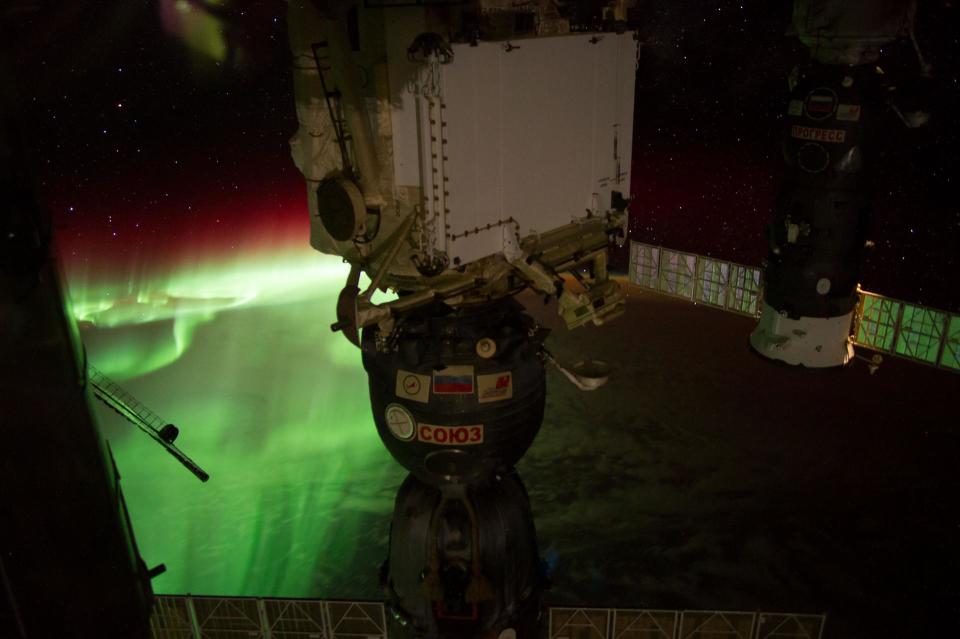 Earth Observation taken during a night pass by the Expedition 40 crew aboard the International Space Station (ISS). A docked Soyuz spacecrat is also visible in foreground. Image: NASA