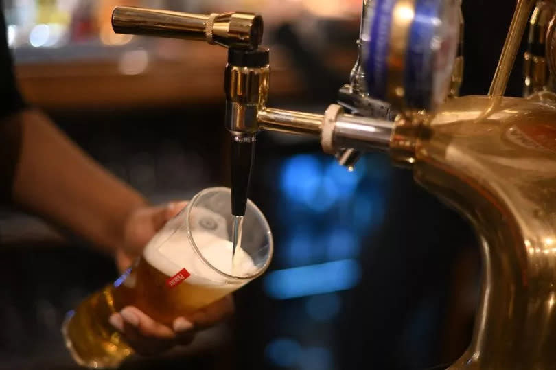 Man pouring pint