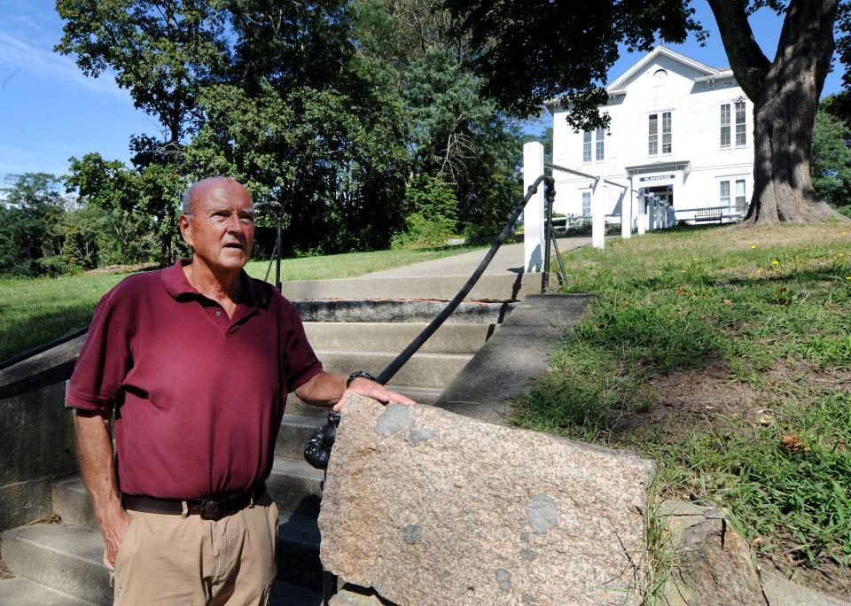 Orleans Historical Commission chair Ron Petersen stands outside the Academy Playhouse, in Orleans one of several buildings that are in the proposed historic district. The playhouse used to serve as the town hall.