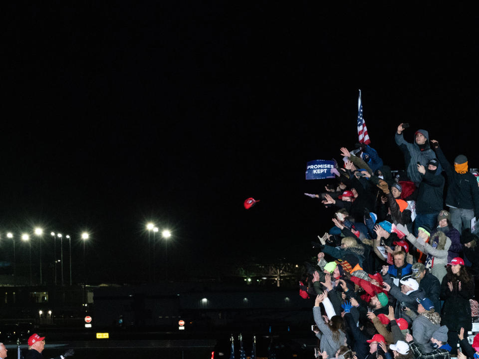 <strong>Grand Rapids, Mich., Nov. 3, 2020.</strong> A hat is tossed between Trump and his supporters at the President's final rally before the election.<span class="copyright">Peter van Agtmael—Magnum Photos for TIME</span>