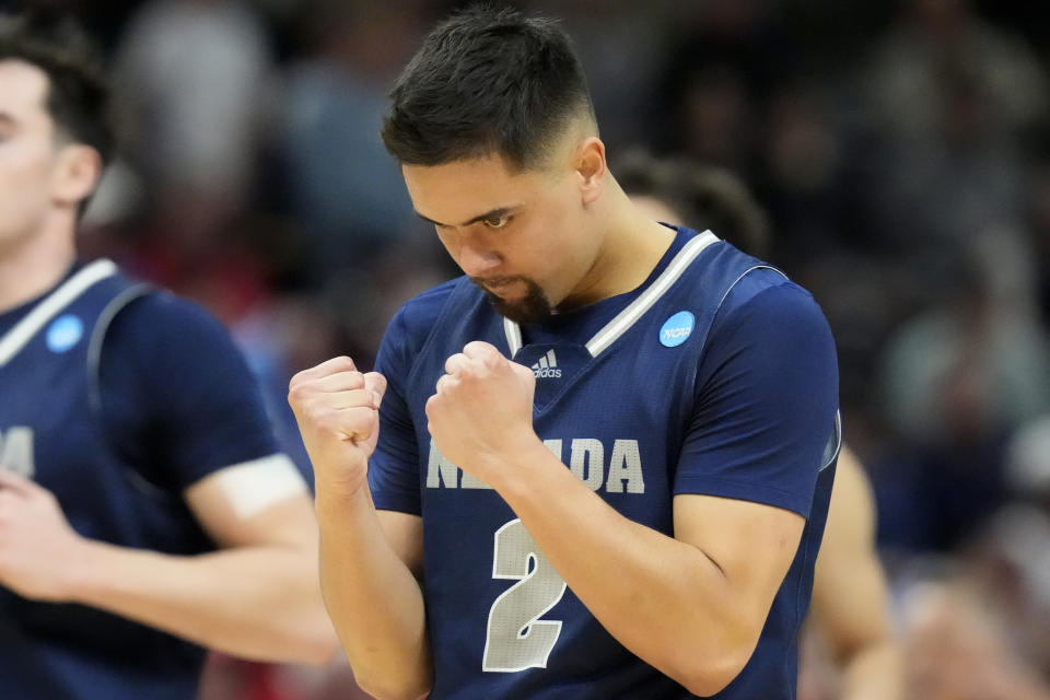Nevada guard Jarod Lucas (2) reacts as he walks up court during the first half of a first-round college basketball game against Dayton in the NCAA Tournament in Salt Lake City, Thursday, March 21, 2024. (AP Photo/Rick Bowmer)