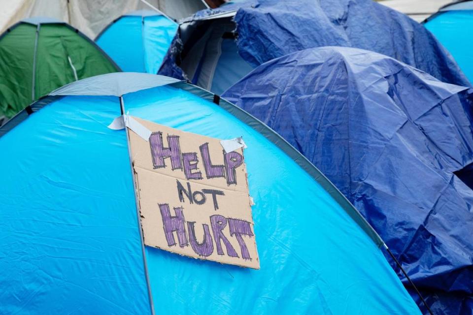 Unhoused people, with the help of volunteers from Boise Mutual Aid Collective, set up tents as part of a demonstration protesting the treatment of homeless people and the need for housing. The protest was held at the corner of North Sixth and West Jefferson streets.