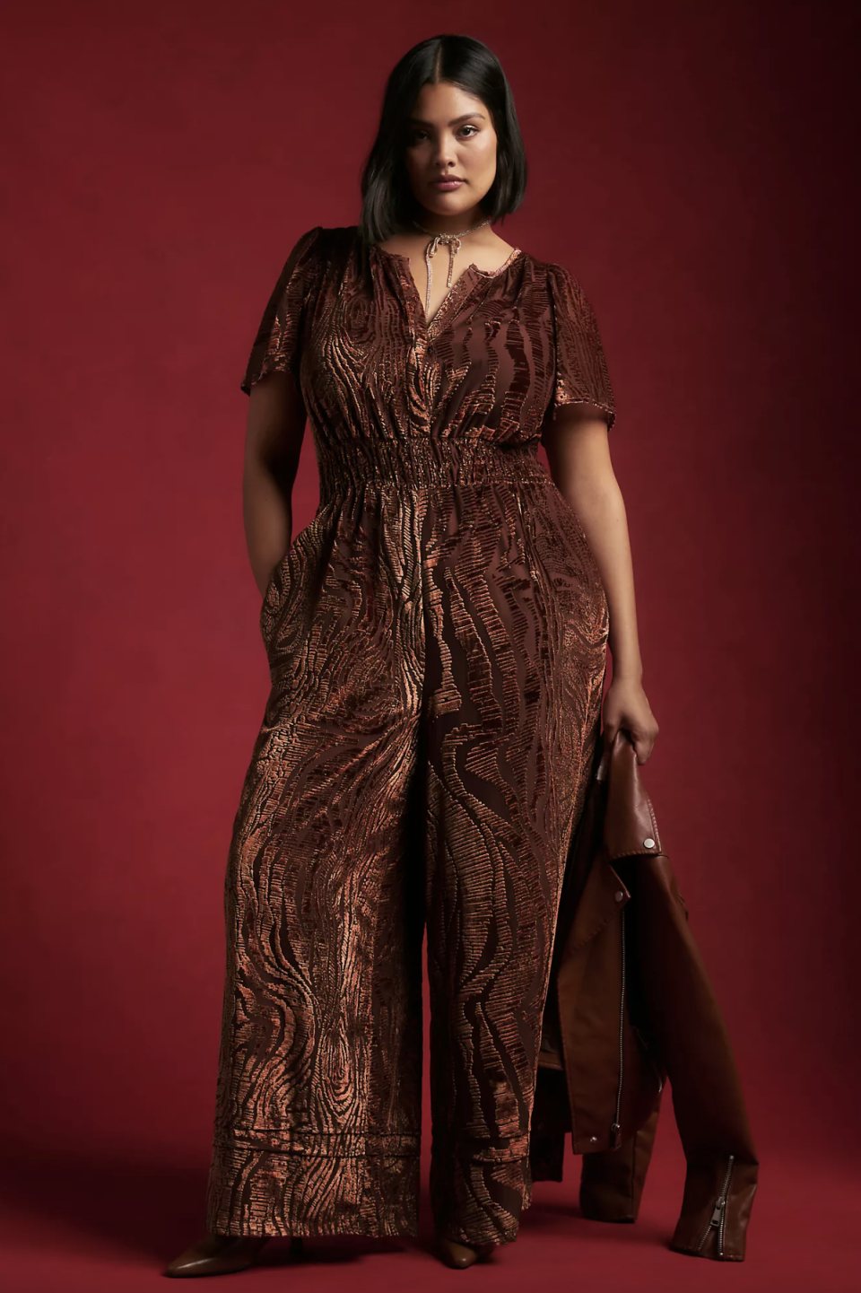 model in dark brown and red The Somerset Jumpsuit: Velvet Burnout Edition (photo via Anthropologie)