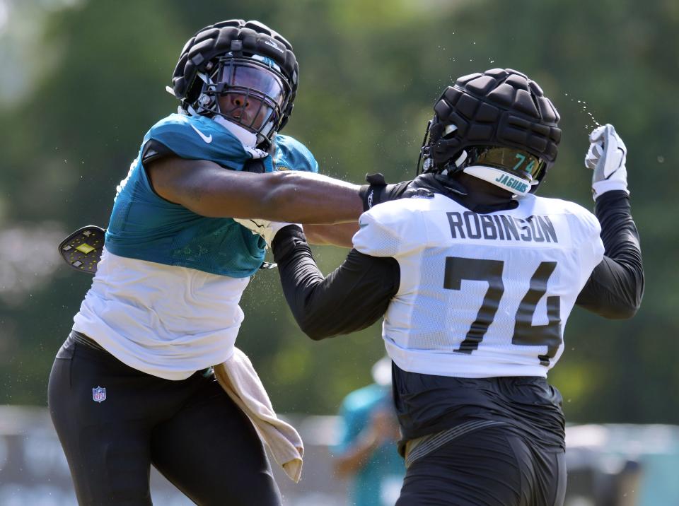 Jacksonville Jaguars outside linebacker Travon Walker (44) tries to get past offensive lineman Cam Robinson (74) during one-on-one drills during Monday's training camp. The Jacksonville Jaguars held training camp Monday, August 1, 2022, at the Episcopal School of Jacksonville Knight Campus practice fields on Atlantic Blvd.