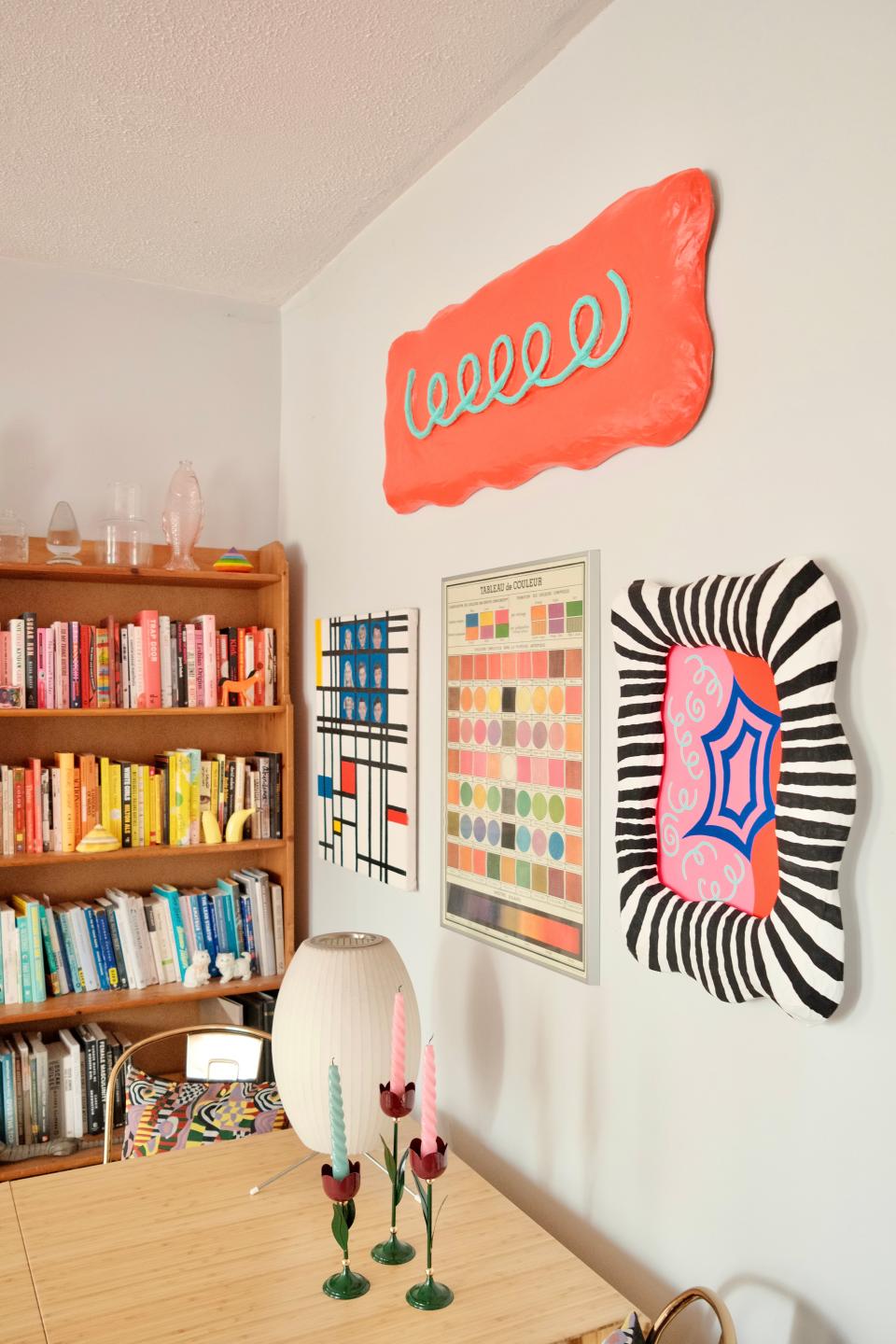 No corner is too small to be covered in color. A patterned pillow from Zoe’s collab with Tyler McGillivary peeks out of a kitchen chair.