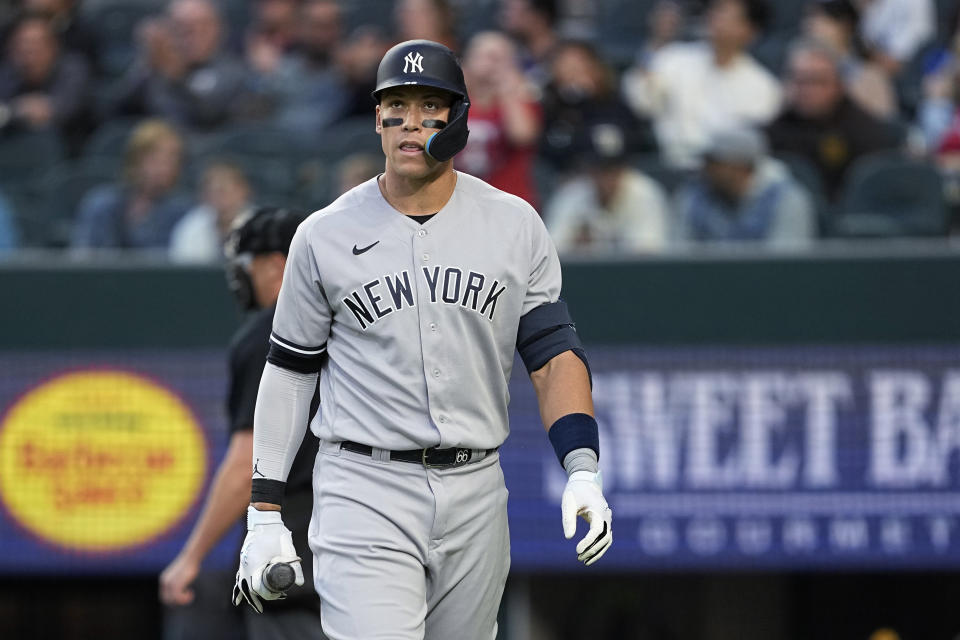 New York Yankees' Aaron Judge walks to the dugout after striking out against the Texas Rangers during the second inning of a baseball game Thursday, April 27, 2023, in Arlington, Texas. (AP Photo/Tony Gutierrez)
