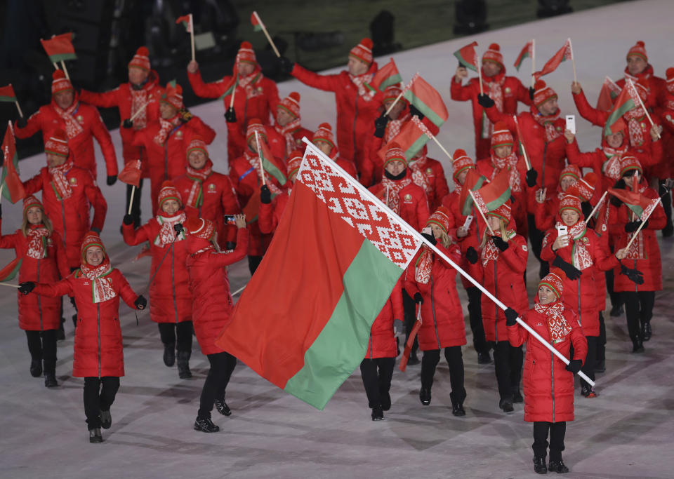 <p>Alla Tsuper carries the flag of Belarus during the opening ceremony of the 2018 Winter Olympics in Pyeongchang, South Korea, Friday, Feb. 9, 2018. (AP Photo/Michael Sohn) </p>