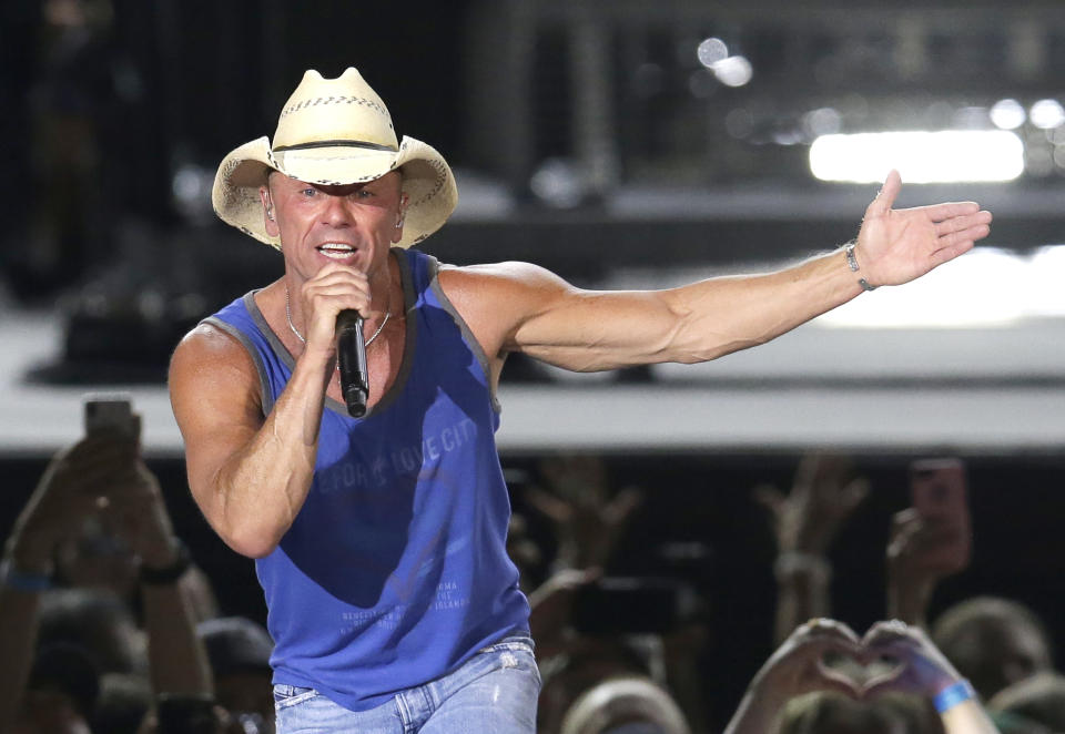 FILE - In this June 23, 2018 file photo, Kenny Chesney performs during the Trip Around the Sun Tour in Phoenix. Chesney’s No Shoes Reefs organization is helping to have an artificial reef installed off of Florida’s Atlantic Coast. The organization and other marine groups donated and installed 13 reef balls on the ocean floor off of Delray Beach in Palm Beach County. (Photo by Rick Scuteri/Invision/AP, File)