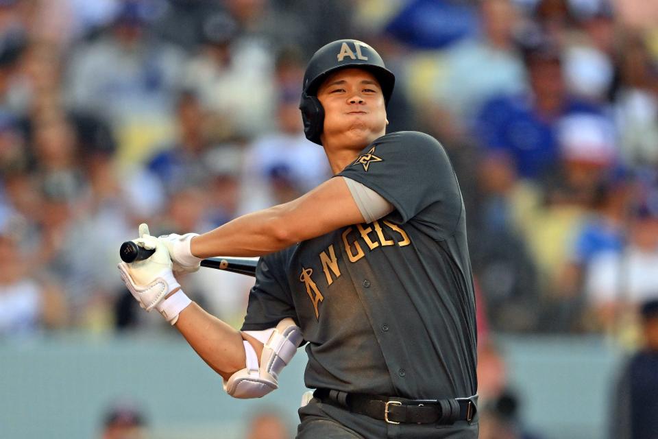 American League pitcher/designated hitter Shohei Ohtani follows through on a swing.