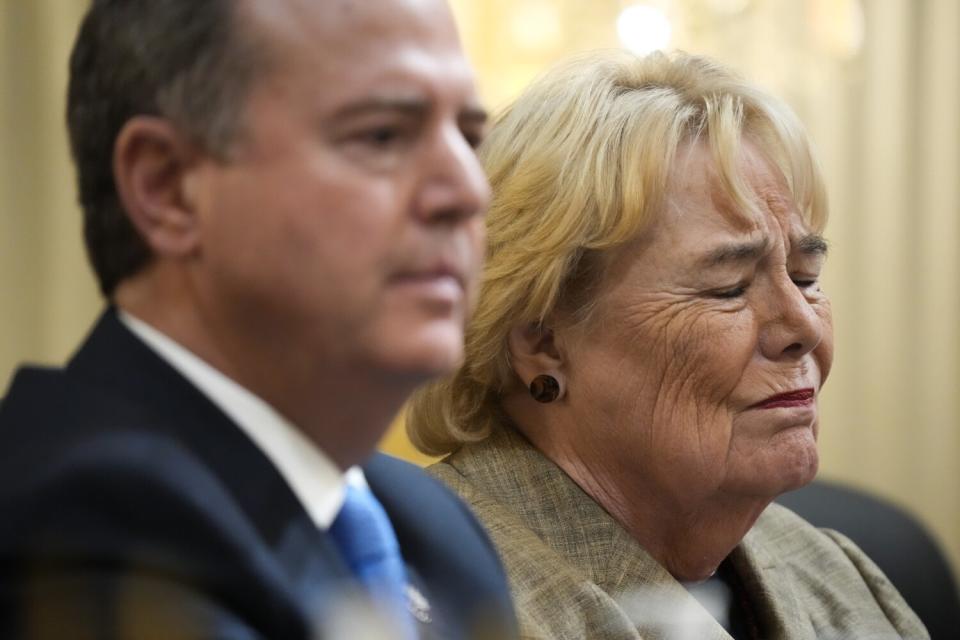 Rep. Zoe Lofgren sitting next to Rep. Adam B. Schiff, appearing upset