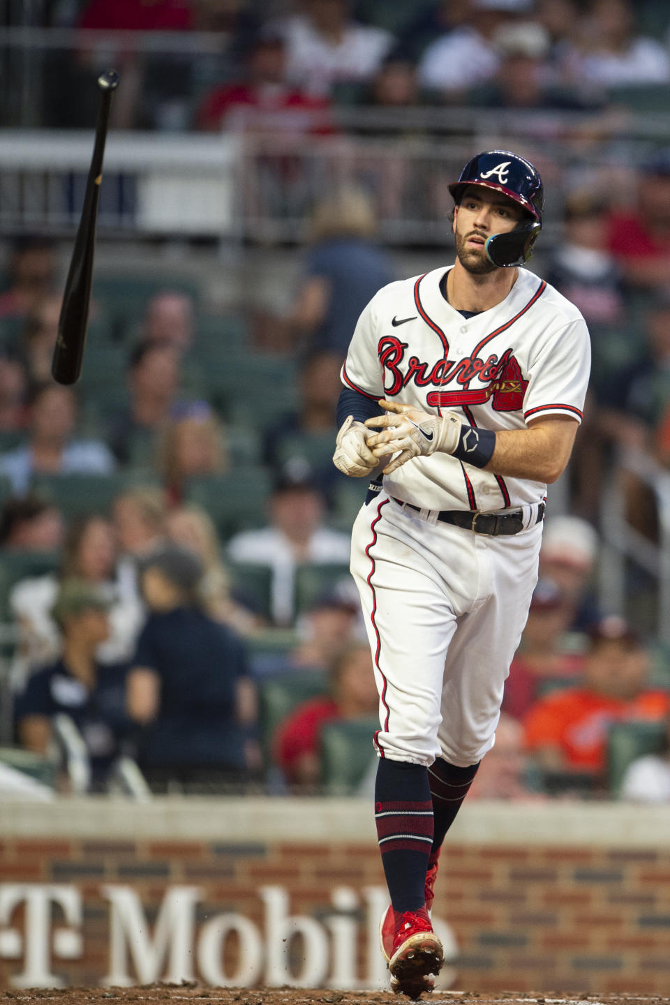 Atlanta Braves Dansby Swanson tosses the bat after ball four in the fourth inning of a baseball game against the Houston Astros Saturday, Aug. 20, 2022, in Atlanta. (AP Photo/Hakim Wright Sr.)