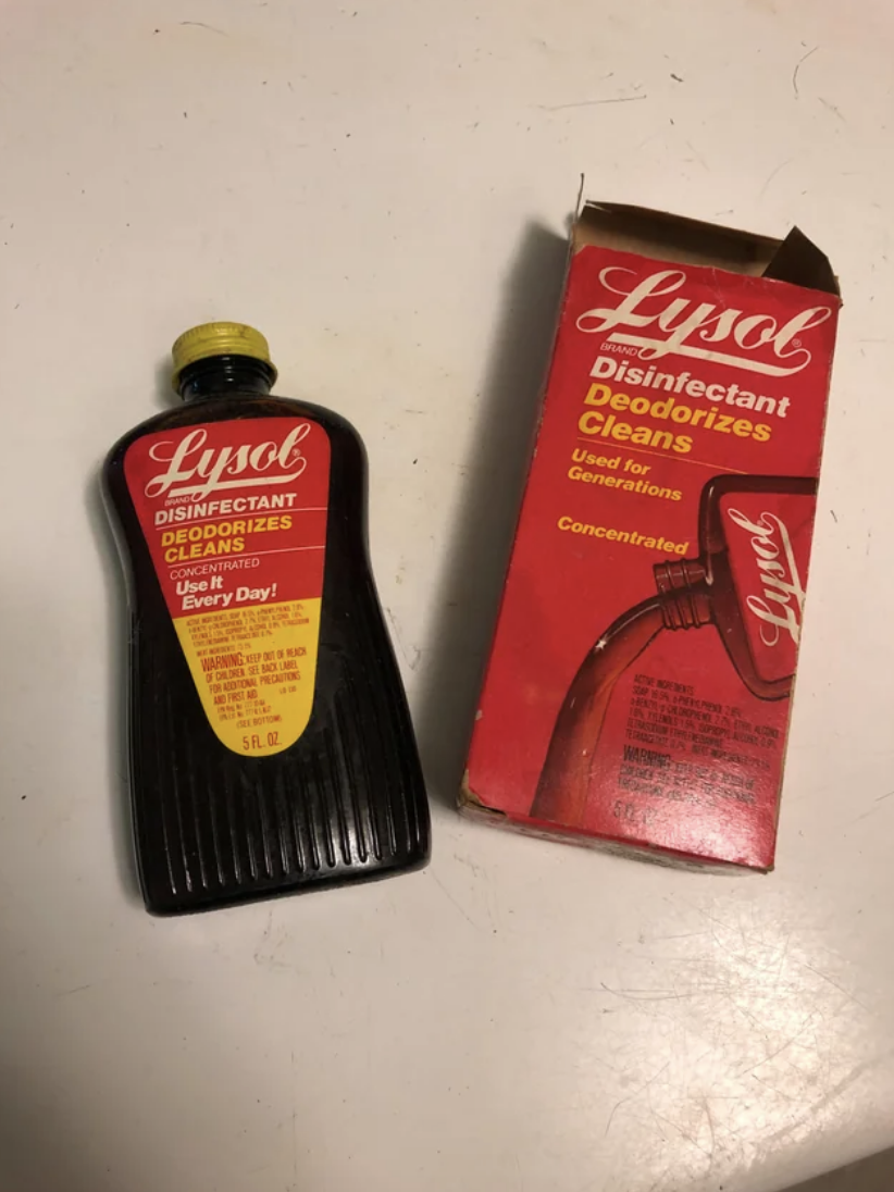 Bottle of Lysol disinfectant next to its vintage packaging, highlighting the brand's design evolution