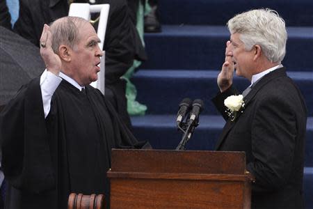 Mark R. Herring (R) is sworn in as Virginia's attorney general by retired Judge Thomas Horne in Richmond, Virginia, January 11, 2014. REUTERS/Mike Theiler