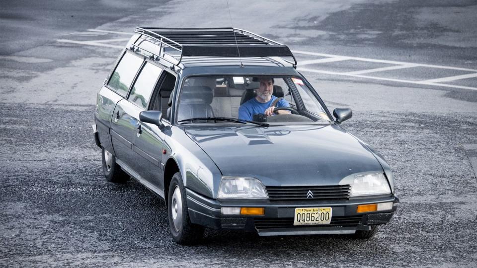 a person driving a citroen cx station wagon