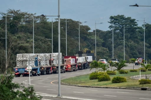 Trucks loaded with humanitarian aid for Venezuela drive towards the Tienditas Bridge in Cucuta, Colombia, where aid from Washington has piled up on the border with Venezuela, unable to enter