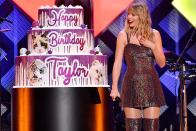 Taylor Swift is surprised with a giant birthday cake onstage during iHeartRadio's Z100 Jingle Ball 2019 presented by Capital One in New York City on Friday night.