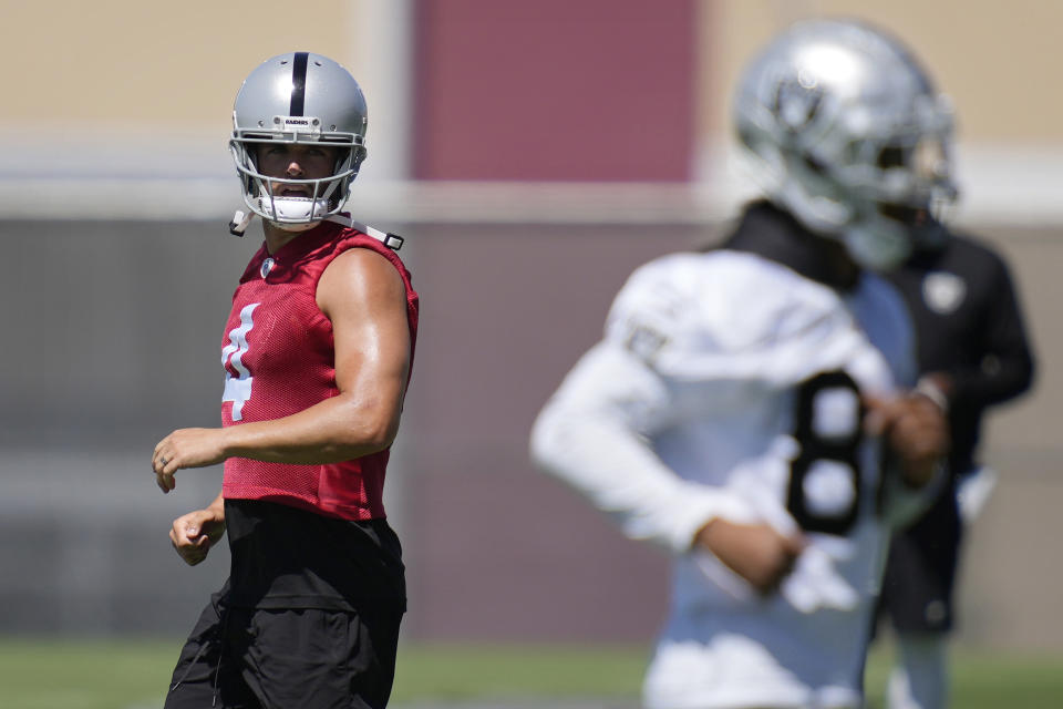 Las Vegas Raiders quarterback Derek Carr warms up at the NFL football team's practice facility Tuesday, June 7, 2022, in Henderson, Nev. (AP Photo/John Locher)