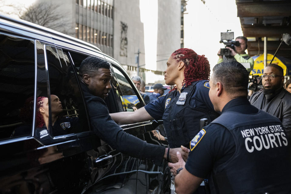 Actor Jonathan Majors shakes hands with court police officers after leaving Criminal Court after his sentencing on Monday April 8, 2024 in New York. (AP Photo/Brittainy Newman)