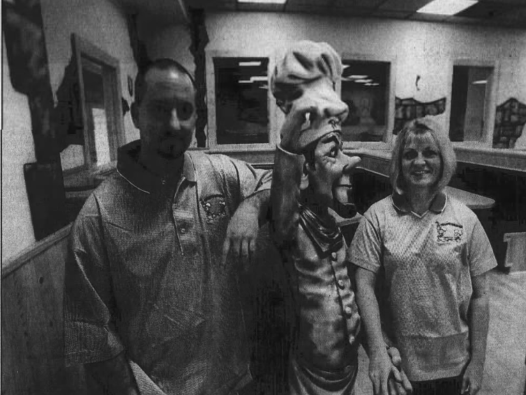 Owners pose for a photo in Brighton's Lil Porky's Revenge.