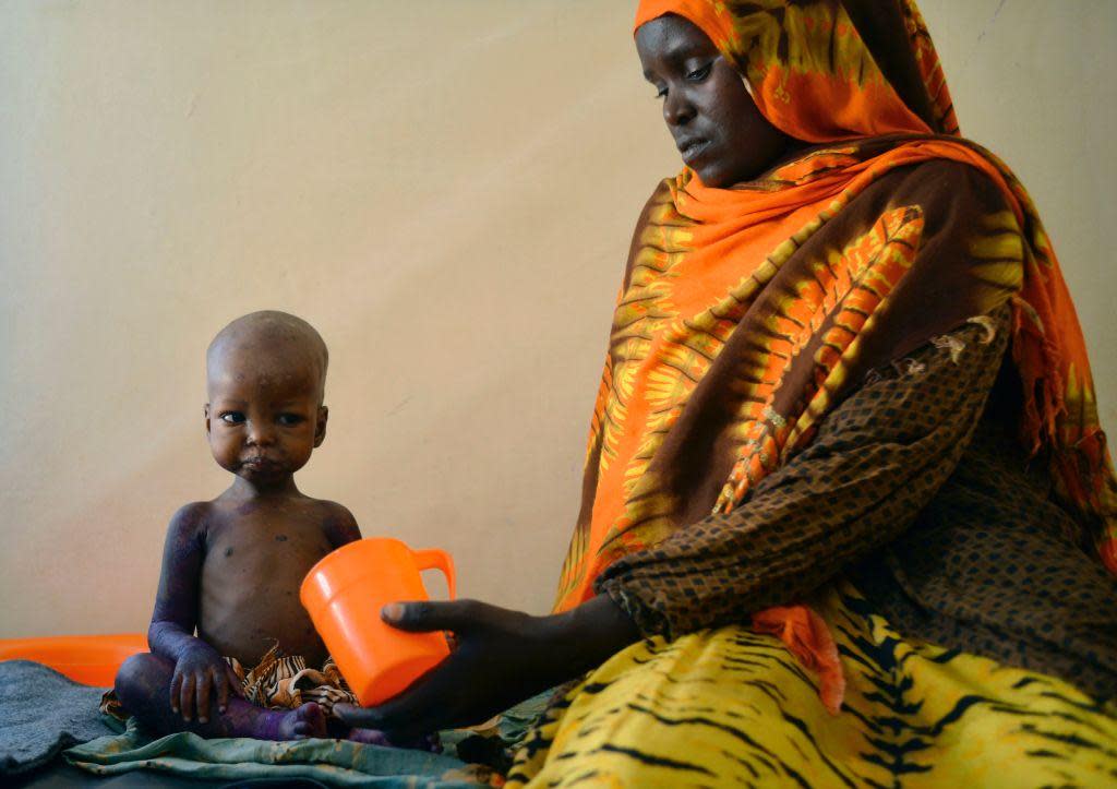 A child is fed a special formula by her mother at a hospital in Baidoa, Somalia, where drought is causing severe malnourishment: AFP/Getty