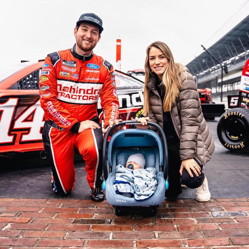 Chase and Marissa Briscoe get their baby, Brooks, his first up-close look at the yard of bricks at Indianapolis Motor Speedway during a sponsor announcement day in December.