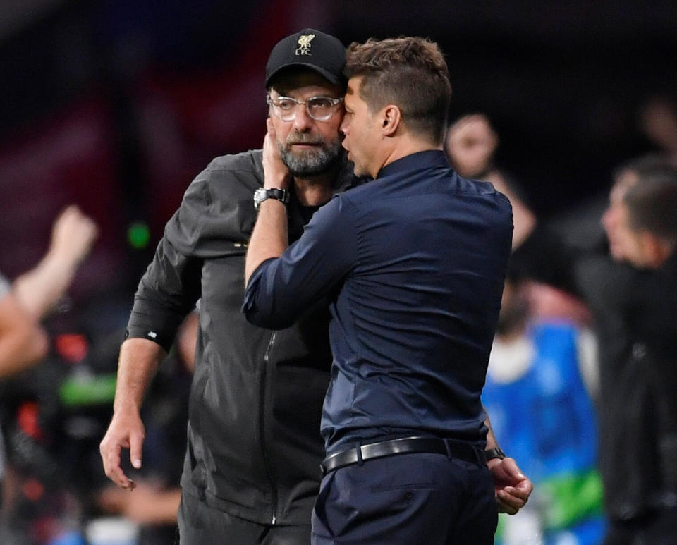 Soccer Football - Champions League Final - Tottenham Hotspur v Liverpool - Wanda Metropolitano, Madrid, Spain - June 1, 2019  Liverpool manager Juergen Klopp and Tottenham manager Mauricio Pochettino embrace after the match   REUTERS/Toby Melville