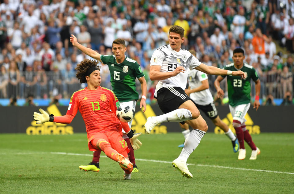 <p>Guillermo Ochoa of Mexico makes a save from a shot by Mario Gomez of Germany during the 2018 FIFA World Cup Russia group F match between Germany and Mexico at Luzhniki Stadium on June 17, 2018 in Moscow, Russia. (Photo by Dan Mullan/Getty Images) </p>