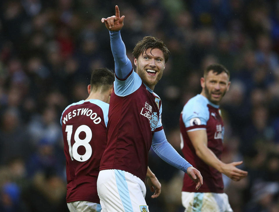 Burnley's Jeff Hendrick celebrates his side's first goal of the game with team-mates Ashley Barnes and Phil Bardsley during the English Premier League soccer match between Burnley F.C and Fulham at the Turf Moor stadium, Burnley, England. Saturday, Jan. 12, 2019. (Dave Thompson/PA via AP)