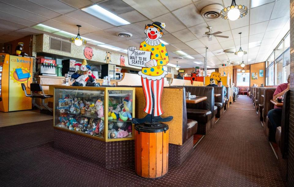 A wooden clown cut-out stands near the front door of Pancake Circus in Sacramento earlier this month. .