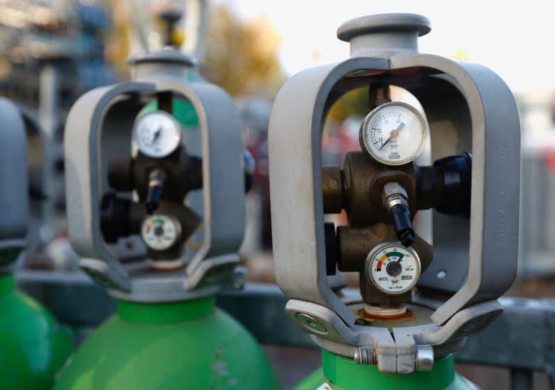 FILE PHOTO: Gas cylinders are stored at at a gas vendor shop in Sint-Pieters-Leeuw