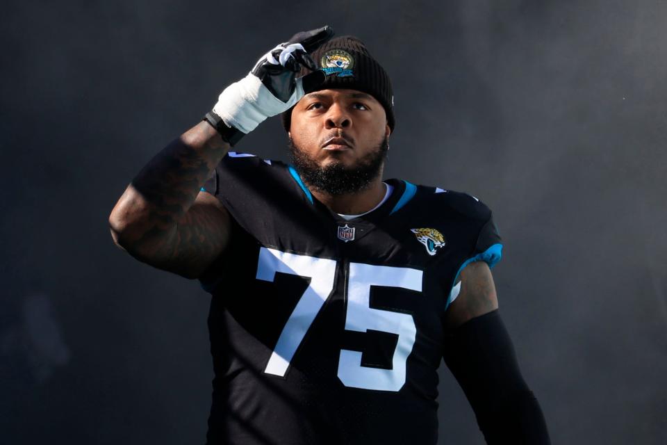 Jacksonville Jaguars offensive lineman Jawaan Taylor (75) takes to the field before a regular season NFL football matchup Sunday, Dec. 18, 2022 at TIAA Bank Field in Jacksonville. The Jacksonville Jaguars edged the Dallas Cowboys 40-34 in overtime. [Corey Perrine/Florida Times-Union]