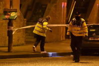 Police officers attend to the scene of a shooting at Poplar Row in Dublin, Ireland February 8, 2016. REUTERS/Clodagh Kilcoyne