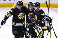 Boston Bruins right wing David Pastrnak (88) is congratulated after his goal during the first period of Game 2 of an NHL hockey Stanley Cup first-round playoff series against the Toronto Maple Leafs, Monday, April 22, 2024, in Boston. (AP Photo/Charles Krupa)