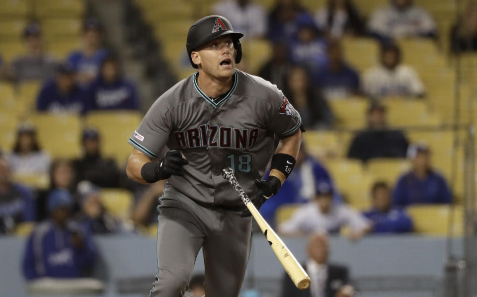 Arizona Diamondbacks' Carson Kelly hits an RBI double during the 13th inning of a baseball game against the Los Angeles Dodgers Saturday, March 30, 2019, in Los Angeles. (AP Photo/Marcio Jose Sanchez)